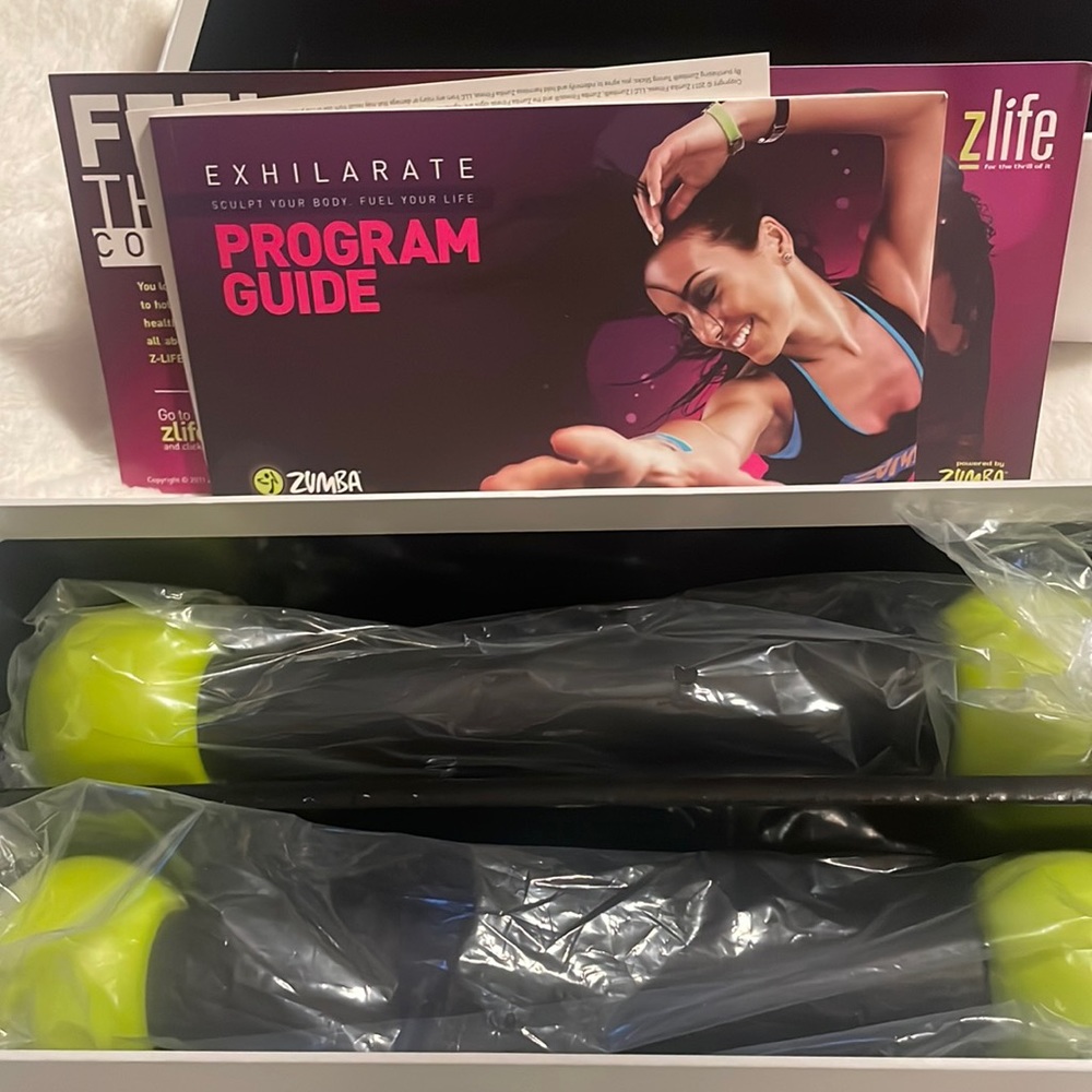 Zumba Exhilarate Program with 5 DVD missing one please see pictures